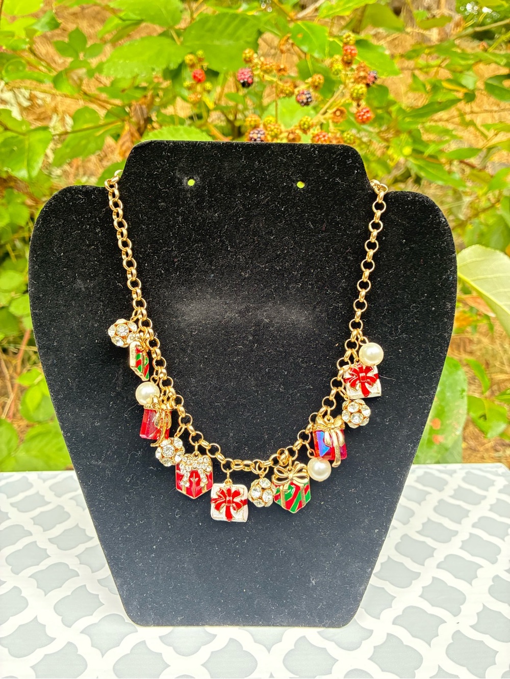 Gold-Tone Holiday Charm Necklace with Red and Green Gift Accents